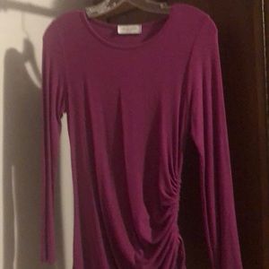 Barely worn jersey top. Side can be let out or cinched up.